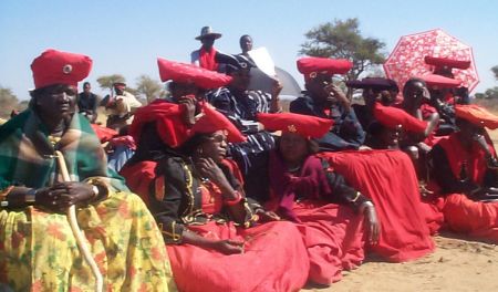 COMMEMORATION OF HAMAKARI BATTLE WINBDHOEK, 12 AUG 2002 - Hundres of Hereros gathered on 11 August to commemorate the Hamakari Battle where thousands of Hereros were massacred by the Germans in 1904. They gathered at Hamakari which is situated two kilometres outside Okakarara. These women clad in Otjiserandu dresses witnessed the ceremony.(Photo by Uushona Hiskia) NAMPA
