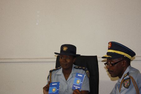 Windhoek, 29 March 2012-Inspector Kauna Shikwambi and Deputy Commissioner Edwin Kanguatjivi of the Namibian Police Force (NamPol) displaying the newly-published booklets containing a wide range of safety and crime prevention tips to the media here on Thursday.(photo by Simon Kopper Endjala) NAMPA