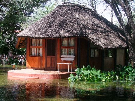 RUNDU, 30 MAR 2012 – Guest rooms at the Leevi Hakusembe River Lodge situated some 12km west of Rundu have been underwater since last week. The lodge closed for business on Wednesday this week and all its 16 workers have been sent home until floods there subside. (Photo by: Olavi Haikera) NAMPA 