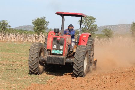 OPUWO, 10 JAN (NAMPA) - Government tractor in Kunene Region busy ploughing maize meal fields at Otjerunda. (Photo by: Tjikunda Kulunga) NAMPA 