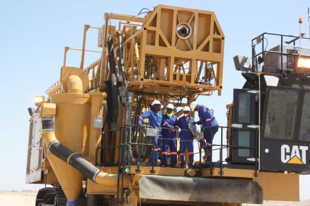 HUSAB, 24 February 2015 - Employees of Rossing Uranium Husab Mine near Arandis on one of the mining machines on site. The construction of the mine started in May 2014 and operations are expected in 2016.(Photo by: Paulus Kiiyala Shiku) NAMPA