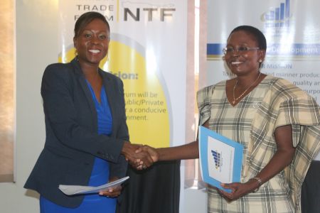 WINDHOEK, 19 March 2015- Namibia Trade Forum (NTF) CEO Ndiitah Nghipondoka-Robiati (L) and Namibia Statistics Agency (NSA) Acting Statistician-General Liina Ndafewayo Kafidi shake hands during the signing ceremony of a MoU between the parties here on Thursday. (Photo by Martha Kanime) NAMPA