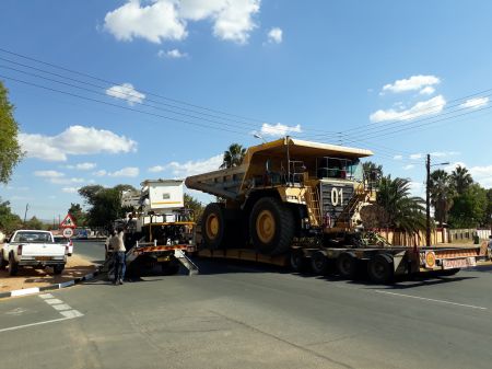 WINDHOEK, 20 June 2017 - Electricians from the City of Windhoek and members of the City Police had to ensure that three haul trucks on their way from Botswana to Rosh Pinah on Tuesday find their way through the capital. Overhead power lines had to be disconnected and lifted by the electricians to ensure that it was safe for the drivers to haul their load. They left Botswana before last weekend and were only expected to reach their destination by this weekend at a maximum speed of around 40 kilometres per hour. (Photo by: Francois Lottering) NAMPA