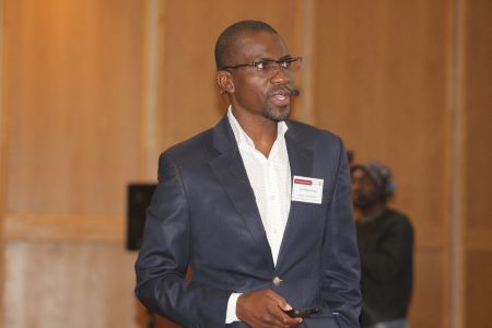 WINDHOEK, 20 September 2018 - Chief Operations Officer at the Namibia Training Authority, Richwell Lukonga presenting an overview of technical vocational education and training in Namibia at the 19th annual symposium of the Bank of Namibia. (Photo by: Esme Konstantinus) NAMPA 