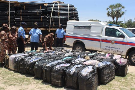 ONHUNO, 14 February 2019 - Commander of the Namibian Police Force in the Ohangwena Region, Commissioner Shinedima Shindinge (third from right) pictured with officers next to 41 bags of cannabis found hidden in a truck intercepted near Eenhana on Wednesday. (Photo by: Mathias Nanghanda) NAMPA