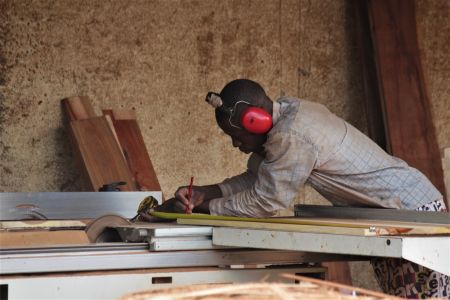 RUNDU, 22 January 2020 - One of the local carpenters in Rundu busy working on a wood cutting machinery. (Photo by:Petrus Muronga) NAMPA 