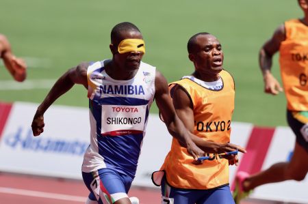 TOKYO, 28 August 2021 - T11 sprinter Ananias Shikongo and his guide Sem Shimanda in action during the heats of the men’s T11 400 metre (m) race at the 2020 Paralympic Games in Tokyo, Japan. (Photo by: Hesron Kapanga) NAMPA