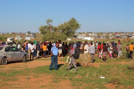 OTJIWARONGO, 02 February 2022 - Residents of the Eie Risiko informal settlement of Otjiwarongo attends a community meeting with the municipality where plans to relocate them to a new residential reception area was announced by mayor Gottlieb Shivute on Wednesday evening. (Photo by: Mulisa Simiyasa) NAMPA