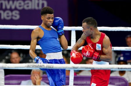 BIRMINGHAM, 01 August 2022 – Namibia’s featherweight (54-57 kilogram) boxer, Tryagain Morning Ndevelo (in blue), in action against Jone Davule of Fiji at the NEC Centre during the 2022 Birmingham Commonwealth Games. (Photo by: Hesron Kapanga) NAMPA