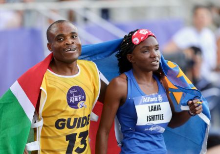 PARIS, 10 July 2023 – Paralympic sprinter Lahja Ishitile and her guide Sem Shimanda celebrating after winning a silver medal in the T11 women's 400 metres at the Charlety Stadium during the International Paralympic Committee (IPC) 2023 World Para Athletics Championships in Paris, France. (Photo by: Hesron Kapanga) NAMPA