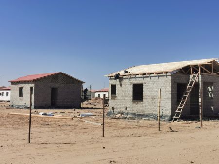 SWAKOPMUND, 21 July 2023 - Houses being constructed under Mass Housing Programme in Swakopmund nearing completion. The houses are part of the 319 houses which were handed over to New Era Investment in October 2022 to complete, after being abandoned for over five years by another contractor. (Photo by: Isabel Bento) NAMPA