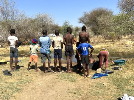 OKAHANDJA, 06 October 2023 - Children from the Five Rand informal settlement on the outskirts of Okahandja bathing and washing their clothes in the riverbed. (Photo by: Linea Dishena) NAMPA