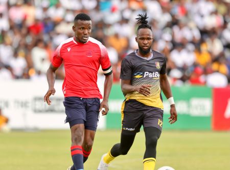 WINDHOEK, 14 October 2023 - Eeshoke Chula Chula Football Club attacking midfielder Leevi Alfeus (in black and gold) in action against Ronald Ketjijere of African Stars during their 2023/24 Debmarine Namibia Premiership fixture at the Hage Geingob Stadium in Olympia. (Photo by: Hesron Kapanga) NAMPA 