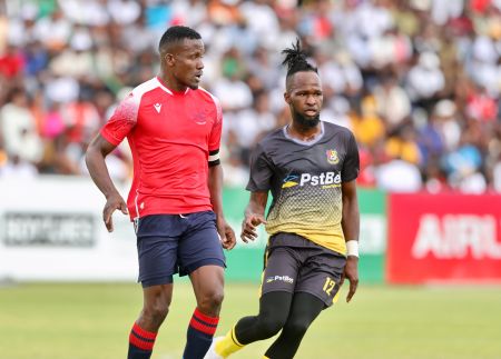 WINDHOEK, 14 October 2023 - Eeshoke Chula Chula Football Club attacking midfielder Leevi Alfeus (in black and gold) while in action against Ronald Ketjijere of African Stars during their 2023/24 Debmarine Namibia Premiership fixture at the Hage Geingob Stadium in Olympia. (Photo by: Hesron Kapanga) NAMPA 