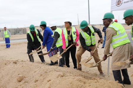 SWAKOPMUND, 27 July 2024 - Minister of Urban and Rural Development Erastus Uutoni, the Mayor of Swakopmund Dina Namubes and other municipality officials as well as Quintessential Construction owners at the recent groundbreaking ceremony of the construction of over 140 houses in Swakopmund. The houses are to be constructed by the construction Company, through an agreement between them, the municipality of Swakopmund who approved land and the Development Bank of Namibia which gave the loan. (Photo by:Isabel Bento) NAMPA