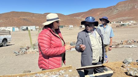 XOBOXOBOS, 27 July 2024 - United Nations Development Program Resident Representative in Namibia Alka Bhatia with Deputy Executive Director in the Mines Ministry Erasmus Shivolo looking at some of the semi-precious stones mined by small-scale miners at Xoboxobos in the Uis Area in Erongo Region. (Photo by: Isabel Bento) NAMPA