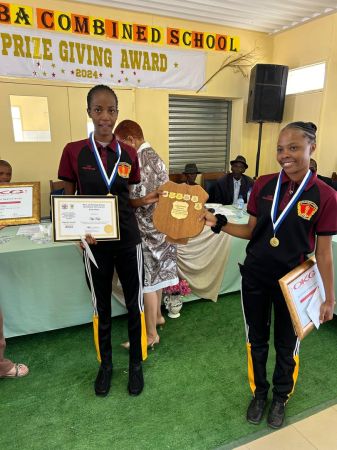 EHOMBA, 02 AUGUST 2023 - Outjo SDecondary School learners July Schmidt and Upi Kapi shared the gold award for the best overall performing NSSCO category after scoring 35 points last year during the Kunene regional award ceremony. The top performers in both categories received N.dollars 2 000 in prize money from Outjo's OK Grocer. (Photo by: Uakutura Kambaekua) NAMPA.