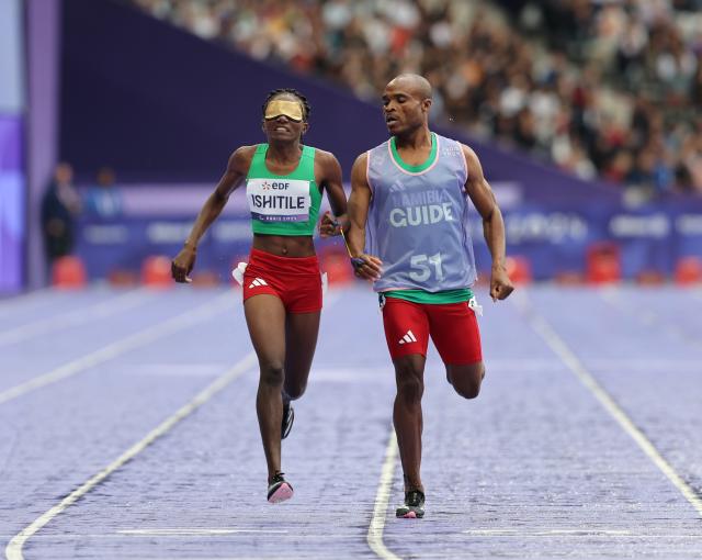 PARIS, 30 August 2024 - Namibia's T11 Paralympic sprinter, Lahja Ishitile and her guide Sem Shimanda while competing in the T11 400 metre race, which was their opening race of the Paris 2024 Paralympic Games at the Stade de France. (Photo by: Hesron Kapanga) NAMPA