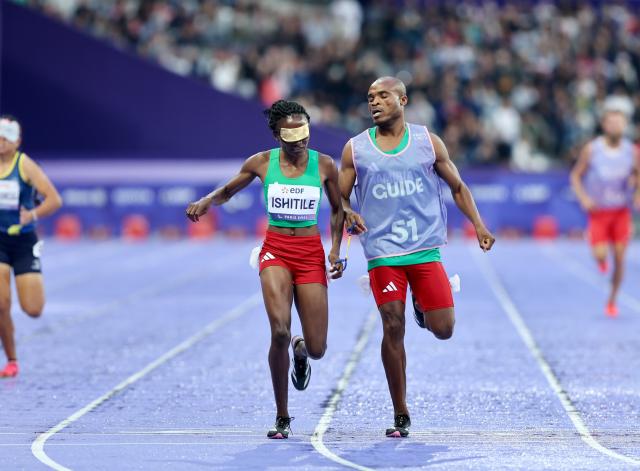 PARIS, 30 August 2024 - Namibia's T11 Paralympic sprinter, Lahja Ishitile and her guide Sem Shimanda pictured while competing in the T11 400 metre semi-finals during day one of field and track events at the Paris 2024 Paralympic Games. (Photo by: Hesron Kapanga) NAMPA