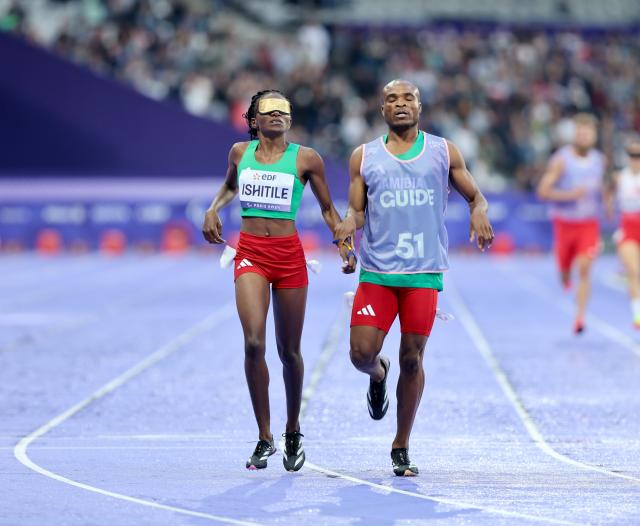 PARIS, 30 August 2024 - T11 Paralympic sprinter, Lahja Ishitile and her guide Sem Shimanda while competing in the T11 400 metre semi-finals on day one of field and track events at the Paris 2024 Paralympic Games. (Photo by: Hesron Kapanga) NAMPA