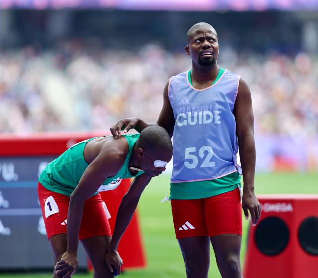 PARIS, 31 August 2024 – Paralympic sprinter Ananias Shikongo and his guide Even Tjiuiju pictured after finishing the heat of the men’s T11 400 metre (m) race of the Paris 2024 Paralympic Games at the Stade de France in Paris. (Photo by: Hesron Kapanga) NAMPA