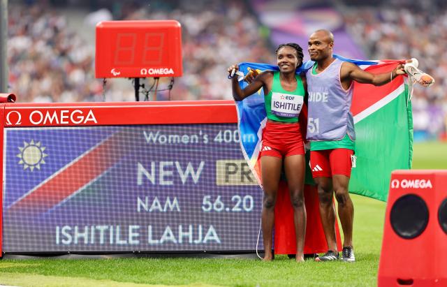 PARIS, 31 August 2024 – Paralympic sprinter Lahja Ishitile and her guide Sem Shimanda celebrating after winning a gold medal at the Paris 2024 Paralympic Games and setting a new Paralympic record in the women’s T11 400 metre race. Ishitile and Shimanda clocked 56.20 seconds to win gold at the Stade de Paris. (Photo by: Hesron Kapanga) NAMPA
