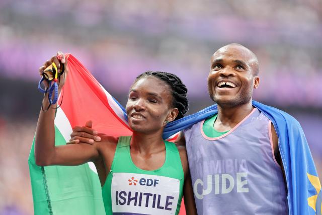 PARIS, 31 August 2024 – Paralympic sprinter Lahja Ishitile and her guide Sem Shimanda celebrate after winning a gold medal at the Paris 2024 Paralympic Games with a new Paralympic record in the women’s T11 400 metre race. They clocked 56.20 seconds to win a gold medal at the Stade de France. (Photo by: Hesron Kapanga) NAMPA
