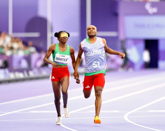 PARIS, 02 September 2024 – Paralympic sprinter Lahja Ishitile and her guide Sem Shimanda while in action during the women’s T11 100 metre (m) semi-finals at the Paris 2024 Paralympic Games at the Stade de France in Paris, France. (Photo by: Hesron Kapanga) NAMPA