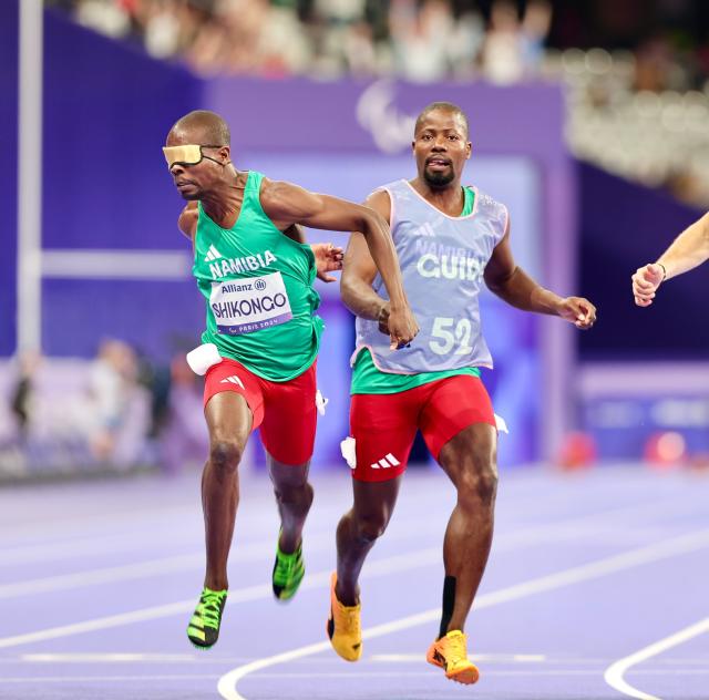 PARIS, 04 September 2024 – Namibian sprinter Ananias Shikongo and his guide Even Tjiuiju in action during the semi-final heats of the men’s T11 100-meter race at the Stade de France during the Paris 2024 Paralympic Games. (Photo by: Hesron Kapanga) NAMPA