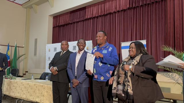 SWAKOPMUND, 19 September 2024 - Minister of Trade and Industrialisation (MIT) Lucia Iipumbu, Erongo Governor Neville Andre Itope and MIT Erongo Regional Coordinator Deputy Director Pinehas Shinyala witnessing the handover of ownership letters to beneficiaries of the Equipment Aid Scheme (EAS) and the Industrial Upgrading and Modernisation Programme (IUMP) grants in Erongo Region. (Photo by: Isabel Bento) NAMPA