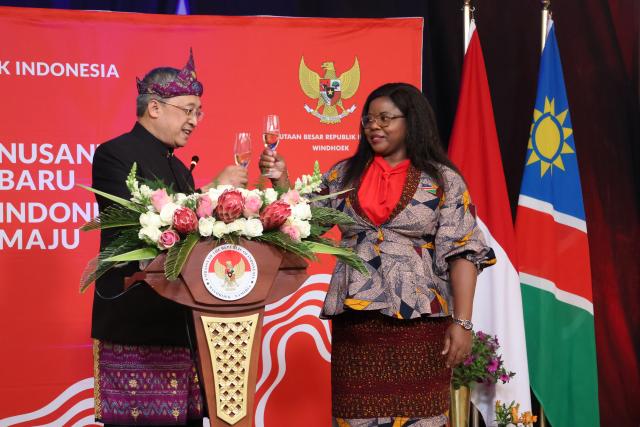 WINDHOEK, 02 October 2024- Indonesian Ambassador Wisnu Edi Pratignyo (L)and Deputy Minister of International Relations and Cooperation, Jennely Matunud (R) toasting  at the 79th independence anniversary diplomatic reception. (Photo by: Linea Dishena) NAMPA 