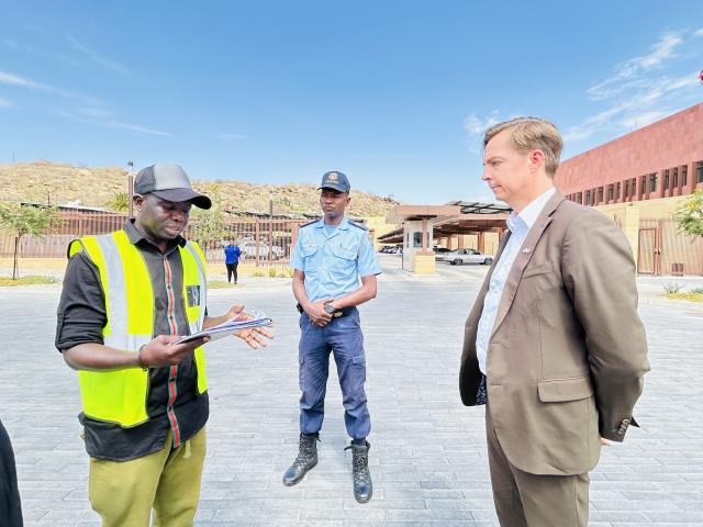 WINDHOEK, 08 OCT (NAMPA)- Julius Mukuve reading an anti-homosexual petition to United States of America Embassy Political Officer, Mike Leroque. (Photo by: Eba Kandovazu)