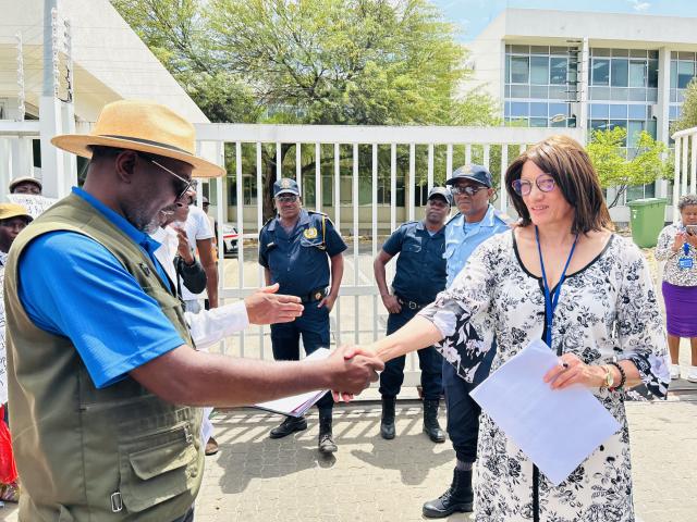 WINDHOEK, 08 October 2024 - Penda Nakathingo reading a petition to United Nations Communications Officer in Namibia, Anthea Basson. (Photo by: Eba Kandovazu) NAMPA