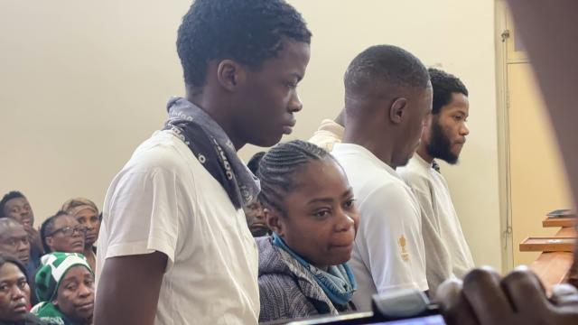 WALVIS BAY, 15 October 2024 - Jessica Gaes pictured alongside six other co-accused in the murder of 24-year-old Matheus Sheehama, who was her boyfriend. The seven made a brief appearance in the Walvis Bay Magistrate's Court where their case was postponed to 22-23 October for bail application. (Photo by: Isabel Bento) NAMPA