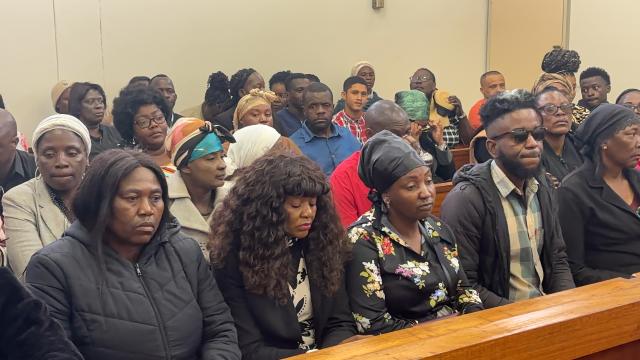 WALVIS BAY, 15 October 2024 -  Family, friends and the mother (in floral shirt) of 24-year-old Matheus Sheehama, attending court hearing of the 7 accused who made a brief appearance in the Walvis Bay Magistrate’s court on Tuesday. The 7 are accused of playing a part in Sheehama’s the murder in August after disappearing from a braai which he attended with his girlfriend. (Photo by: Isabel Bento) NAMPA