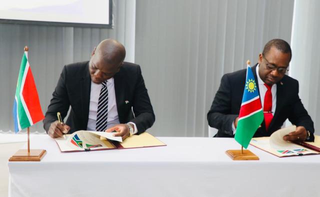 SWAKOPMUND, 15 October 2024 - Co-chairs of the meeting of the Political, Diplomatic and Legal Committee of the Namibia-South Africa Bi-National Commission, Namibia and South Africa’s Minister of International Relations and Cooperation Dr Peya Mushelenga and Ronald Lamola signing their joint-communique at the end of the two-day meeting which took place in Swakopmund. (Photo: Contributed) 