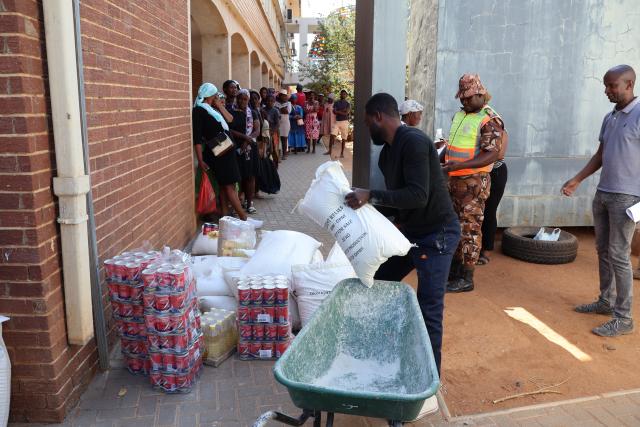 OTJIWARONGO, 16 OCTOBER 2024 - Officials of the Otjiwarongo Constituency office distributes food parcels for the government's drought relief programme at Otjiwarongo on Wednesday morning. (Photo bY Mulisa Simiyasa) NAMPA 