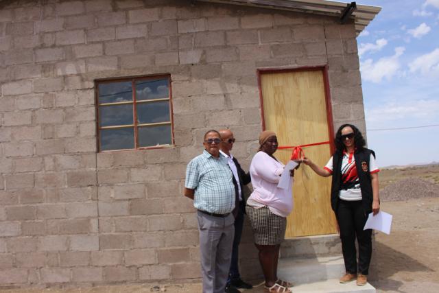 KEETMANSHOOP, 08 November 2024 – Keetmanshoop deputy mayor, Anneline Knaus and councillors Johannes Vries and Easter Isaak pictured with one of the Build Together project beneficiaries, Erna Kanases, in front of one of a Build Together house. (Photo by: Suzith Tjitaura) NAMPA 