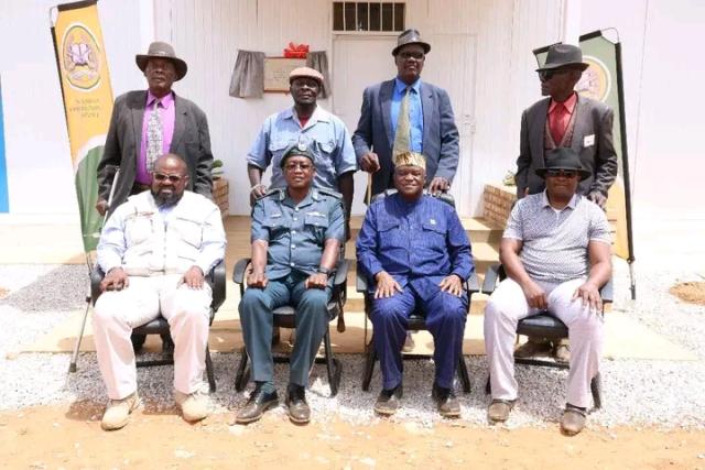 OKAOKO-OTAVI - 14 NOVEMBER 2024 Dr. Albert Kawana, the Minister of Home Affairs, Immigration, Safety, and Security (seated, third in blue), along with the Traditional Chiefs of Okaoko-Otavi, Kunene governor Marius Sheya, Oberth Kandjoze, the Director of the National Planning Commission, and NCS Commissioner Raphael Hamunyela during the inauguration of the Namibian Correctional Service facility in Okaoko-Otavi, located in the Opuwo Rural constituency, on Thursday. (Photo: Contributed) NAMPA.