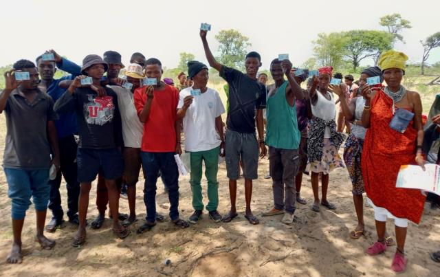 ||Nhoma, 20 November 2024 - A group of San people from the Ju|'Hoansi clan living in ||Nhoma poses for a picture with  their voters cards ahead of Namibia’s 2024 Presidential and National Assembly elections. (Photo: contributed) NAMPA