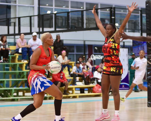 SWAKOPMUND, 11 December 2024 – Namibia national senior women’s team, goalshooter Louise Kausehue (left) while in action against Hanisha Muhammad of Uganda at the Africa Netball Cup 2024 at the Dome in Swakopmund, Namibia. (Photo by: Hesron Kapanga) NAMPA