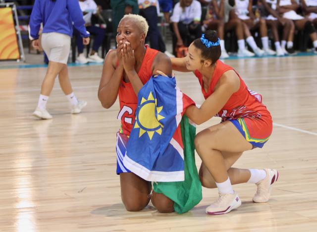 SWAKOPMUND, 12 December 2024 - Louise Kausembe the Namibian Debmarine Desert Jewels goal shooter being comforted by Zante Farmer (right) after their goal difference win against Zimbabwe at the Africa Netball Cup 2024 at the Dome in Swakopmund where the championships were held. (Photo by: Hesron Kapanga) NAMPA