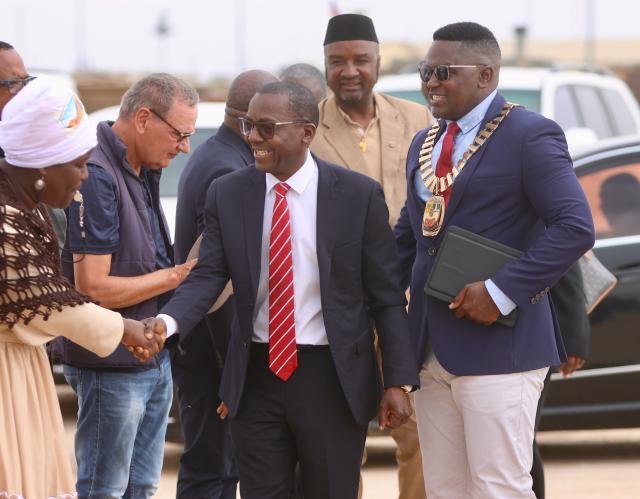 SWAKOPMUND, 13 December 2024 - Minister of Urban and Rural Development, Erastus Uutoni (centre), flanked by the mayor of Swakopmund, Blasius Goraseb (right)  and councillors during the launch of the Informal Settlement Upgrade Project at the DRC Informal Settlement in Swakopmund. The project is aimed at constructing over 800 houses in the DRC Informal Settlement. (Photo by: Hesron Kapanga) NAMPA