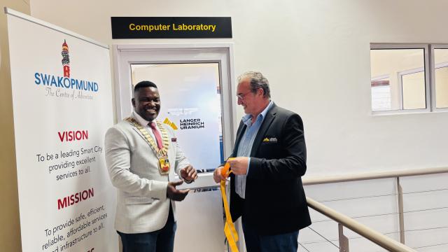 SWAKOPMUND, 17 January 2025 - Swakopmund Mayor Blasius Goraseb and Managing Director of Langer Heinrich Mine Johan Roux officially opening the computer laboratory where 20 computers were donated to the Mondesa Community Library. (Photo by: Isabel Bento) NAMPA