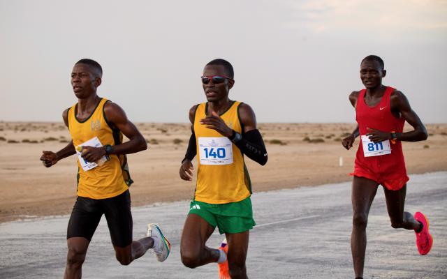 WINDHOEK, 08 March 2025 - Namibia Correctional Service runners Jesaya Matheus (centre) andTangeni Sakaria (left) and Enock Haufiku (right) pose for a picture during the award ceremony the 34th Rössing National Marathon champions in Swakopmund the championship, featured over 3,000  runners. (Photo contributed) NAMPA