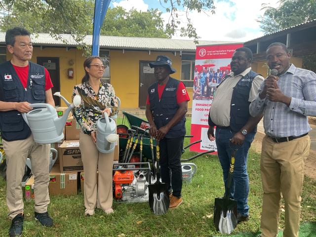 RUNDU, 17 March 2025 - Ambassador of Japan to Namibia Shinichi Asazuma together with FAO representative in Namibia Dr Qingyun Diao handing over agricultural tools and inputs to Governor of the Kavango East Region Bonny Wakudumo and Chairperson of the Kavango East Regional Council Damian Maghambayi at Rundu on Monday. (Photo by: Sawi Hausiku) NAMPA