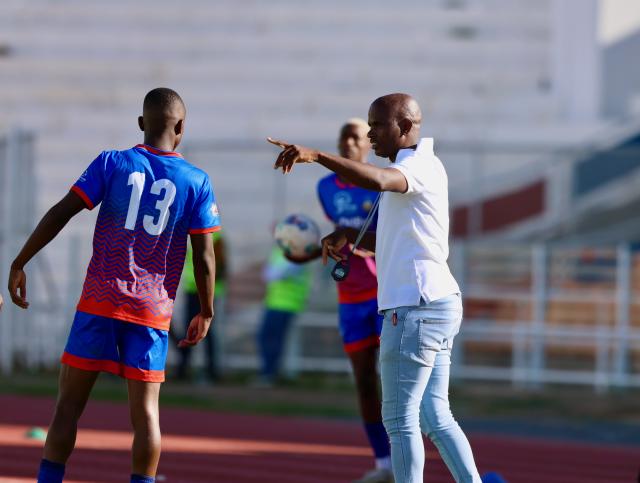 WINDHOEK, 05 April 2025 – Khomas NamPol head coach Fortune Eichab (right) giving instructions to his player during their clash against KK Palace at the Independence Stadium  in the 2024/45 Debmarine Namibia Premiership season. (Photo by: Hesron Kapanga) NAMPA