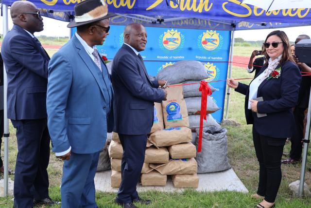 RIETFONTEIN, 30 April 2025 - Prime Minister, Dr Elijah Ngurare cuts ribbon to officially open the practical training sessions of the charcoal production course at the National Youth Service (NYS) at Rietfontein centre outside Grootfontein in the Otjozondjupa Region on Wednesday. This was after a total of 345 recruits of NYS on Wednesday graduated with certificates part-one of the biomass business and charcoal production course at the centre. (Photo by: Mulisa Simiyasa) NAMPA