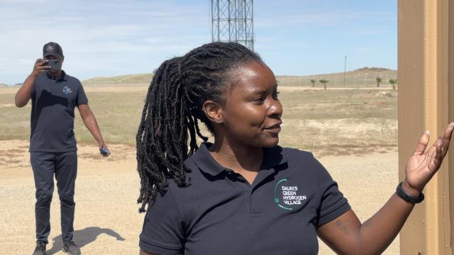 DAURES, 29 April 2025 - Renewable Energy Analyst Aina Kauluma explains DGHV’s living laboratory for renewable energy education. The village’s demo site, features three 3.6 kW wind turbines, a 2.75 kW solar array, batteries, and a 3 kW electrolyser. (Photo by: Isabel Bento) NAMPA