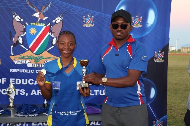 RIETFONTEIN, 04 May 2025 - The best netball player, Vuyolwethu SitholeSithole (L) from the Eswatini Deaf Netball Team receives her trophy from the President of the Namibian Sports Deaf Federation, Abner Sheya (R) on Sunday afternoon shortly after the 2025 National Deaf Sports Games which took place at Rietfontein Sports Stadium in the Otjozondjupa Region. (Photo by: Herson Kapanga) NAMPA